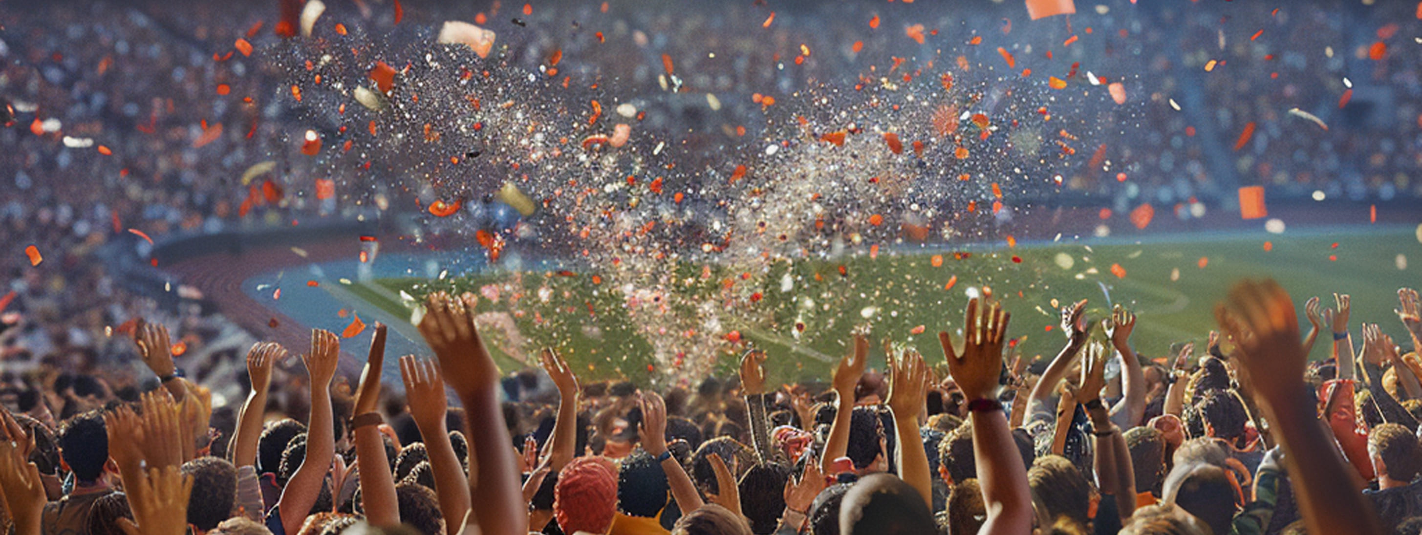 Foule faisant une ola dans un stade pendant un match